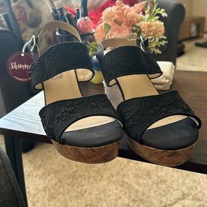 Super cute pair of black wedged sandals. Size 11M
